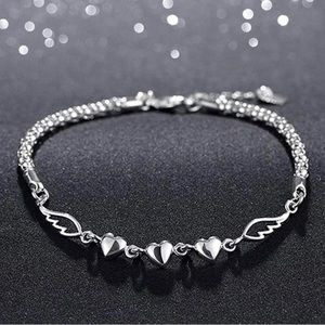 Heart and wing sterling silver bracelet.